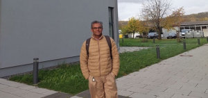 Victor Anandkumar in front of the university